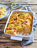Gratinated potatoes with sauerkraut and smoked meat