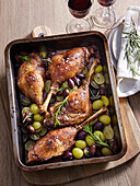 Goose legs with wine grapes and olives