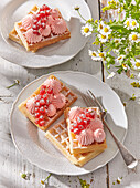 Waffels with red currant whipped cream