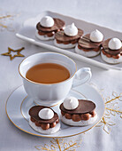 Meringues with nuts and chocolate cream