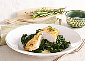 Marinated chicken breast with fresh spinach