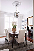 Table with upholstered chairs in the dining room