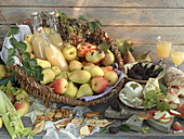 An arrangement of pears, pear juice, dried pear slices and cheese