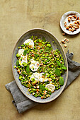 Lemony broad beans with goat's cheese peas and mint