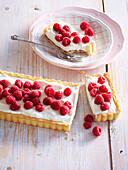 Coconut cake with raspberries and cream