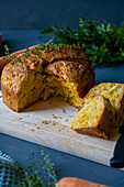 Loaf of Carrot bread garnished with a sprig of thyme