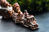 Gingerbread cookies shaped in cars and trucks covered with sugar