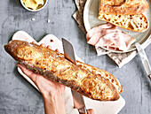 Classic baguette being sliced in half