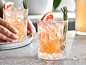 Grapefruit lemonade mocktail with rosemary