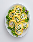 Omelet rolls filled with peas and cream cheese