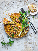 Quiche Lorraine served with parmesan cheese