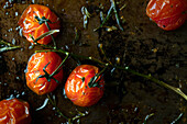 Vine ripened tomatoes roasted on a baking tray