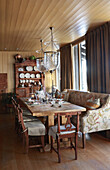 Dining area with upholstered bench in a cabin