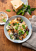 Pumpkin risotto with mushrooms and pine nuts