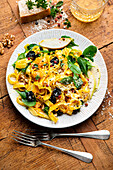Pasta with pumpkin sauce, spinach, and pears