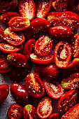 Halved tomatoes seasoned with salt and olive oil