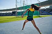 Female track and field athlete throwing javelin
