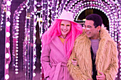 Couple under illuminated arch