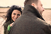 Happy affectionate couple in winter coats