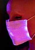 Woman in shimmery pink face mask