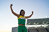 Happy athlete celebrating at competition