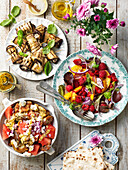 Grilled aubergine rolls with cheese, salad with raspberries, onion and peach, grilled and mashed potatoes with cheese and watermelon