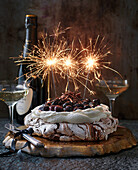 New Year, pavlova with chocolate, whipped cream and cherries