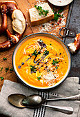 Pumpkin soup garnished with parmesan cheese