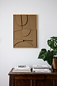 Grafisches Bild mit verschiedenen Eben über Büchern und Monstera