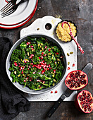Salad with kale and pomergrante and pumpkin seed