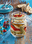 Pickled camembert with chili peppers