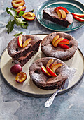 Chocolate cakes with plums