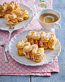 Choux pastry bananas with caramel cream and apples