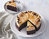 Chocolate cake with caramel cream and walnuts