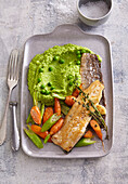 Trout with green pea mash