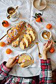 Challah with icing and orange peel and coffee for Christmas breakfast