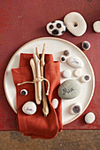 Flotsam and jetsam table decoration made from stones and branches