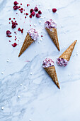 Raspberry and sour cream ice cream in cones