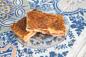 traditional Sicilian mattonella with tomato, ham and cheese