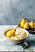 Spiced rice pudding with pistachios and saffron pears