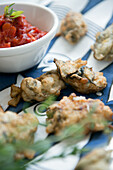 Deep fried oysters with a spicy tomato sauce