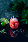 Strawberry-lime cocktail with crushed ice