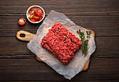 Fresh raw minced meat with ingredients for cooking