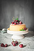 A homemade Japanesse souffle cheesecake served with fresh cherries