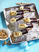 Coconut ice lolly with nuts