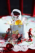 Table decoration with dwarf figures and sweets in small gift bag