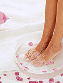 Bare feet in a foot spa