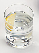 Glass of water with slice of lemon