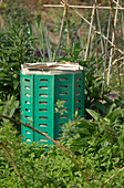 Green plastic compost bin