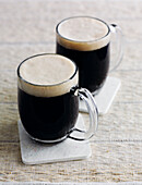 Two glasses of milk stout